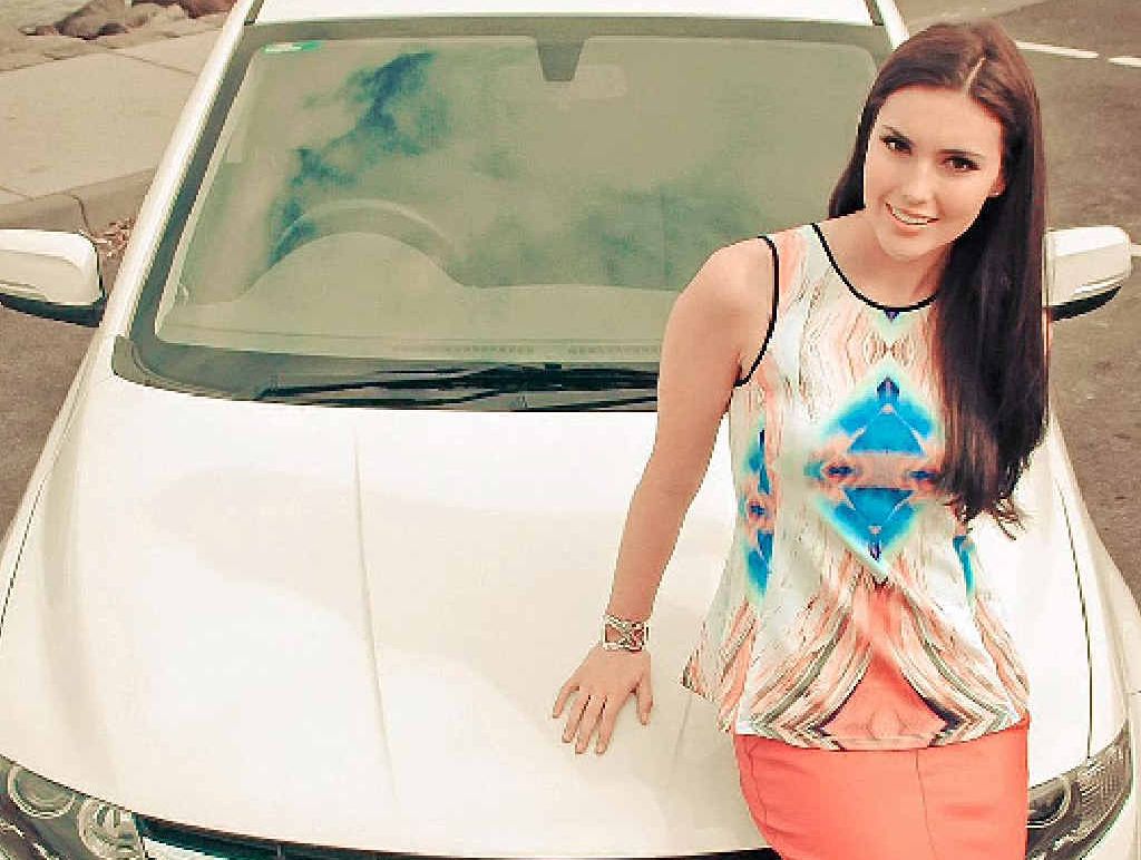 ON A WINNER: Miss Australia Olivia Wells with her Proton Prevé GX. ON A WINNER: Miss Australia Olivia Wells with her Proton Prevé GX.